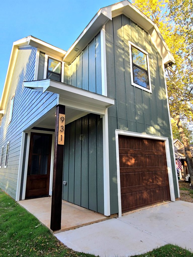 2 story build in Denison, Texas with brown single car garage
